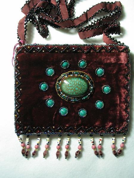 Dark burgundy/maroon small purse w/ 10 pts around center